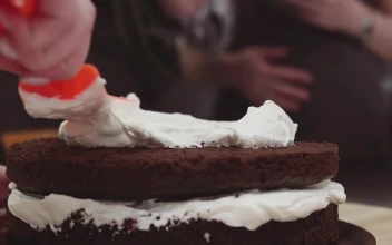 Free Video Stock Spreading Cream On A Chocolate Cake