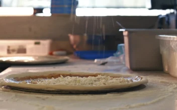 Free Video Stock Spreading Cheese On A Pizza