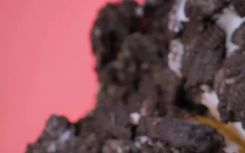 Free Video Stock Stacking Donuts With Cookie Pieces On A Pink Background