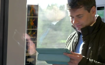 Free Video Stock Standing On A Train With A Tablet