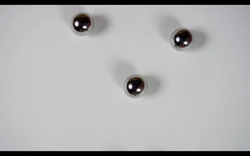 Free Video Stock Steel Pellets Rolling On White Surface