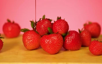 Free Video Stock Strawberries Are Covered In Chocolate On A Pink Background