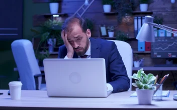 Free Video Stock Stressed Businessman Rubs Eyes While Working On Laptop