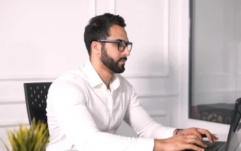 Free Video Stock Stressed Man Works On Laptop In Minimalist Office
