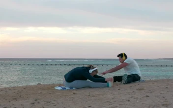 Free Video Stock Stretching Before Going For A Run On The Beach