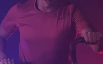 Free Video Stock Strong Man Exercising With A Fitness Air Bike