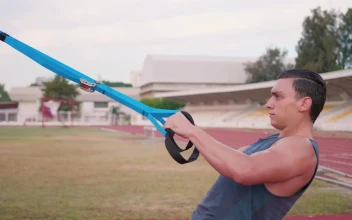 Free Video Stock Strong Man Exercising With Straps