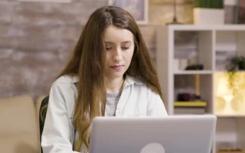 Free Video Stock Student Enjoys Coffee While Typing On Laptop
