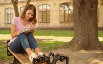 Free Video Stock Student Girl Writing In The Gardens Of A College