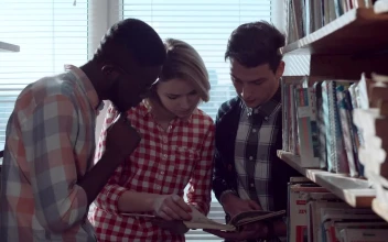 Free Video Stock Students Are Discussing Books In The Library