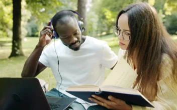 Free Video Stock Students Sit In Park And Discuss Ideas While Reading