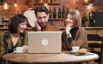 Free Video Stock Stylish Friends Share Ideas At Hip Cafe With Laptop