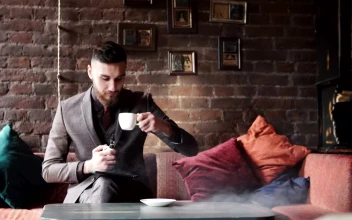 Free Video Stock Stylish Man In Suit Smoking In Coffee Shop