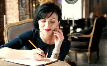Free Video Stock Stylish Woman Talks On Mobile Phone In Vintage Cafe