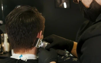 Free Video Stock Stylist Cutting A Boys Hair In A Beautician