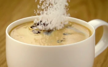 Free Video Stock Sugar Falling Into A Cup Of Coffee
