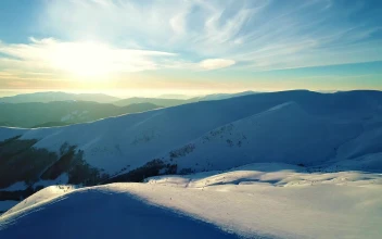 Free Video Stock Sun Illuminating The Snowy Relief Of The Mountains