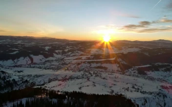 Free Video Stock Sun Setting Behind The Winter Mountains