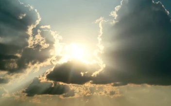 Free Video Stock Sunbeams Through Moving Clouds