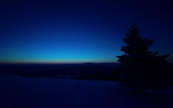 Free Video Stock Sunrise From A Snowy Hill With Pine Trees