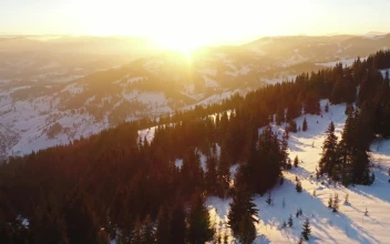 Free Video Stock sunrise in the skyline of the snowy mountains