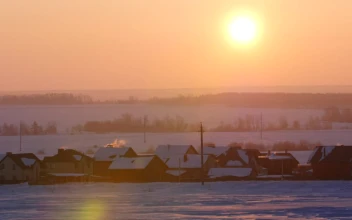 Free Video Stock sunrise over a snowy town landscape