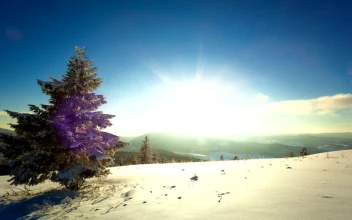 Free Video Stock sunset and dusk sunburst in the winter mountains