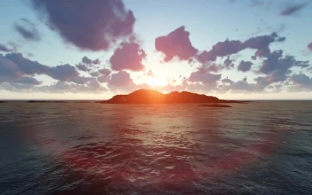Free Video Stock sunset behind the mountains of an island in the sea