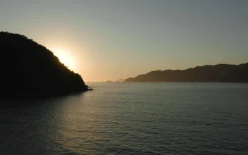 Free Video Stock sunset seen at sea from a coast aerial shot