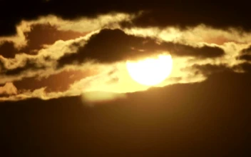 Free Video Stock sunshine appearing behind the clouds