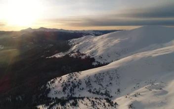 Free Video Stock sunshine illuminating a snowy landscape