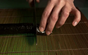 Free Video Stock sushi chef preparing a roll of sushi