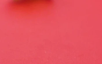Free Video Stock sweets in the shape of pandas rolling on a pink