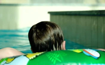 Free Video Stock swimming with an inflatable ring