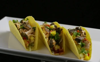 Free Video Stock tacos rotating on a plate on a black background