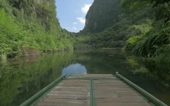 Free Video Stock taking a boat down a river in vietnam