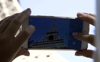 Free Video Stock taking a picture of the eiffel tower close up