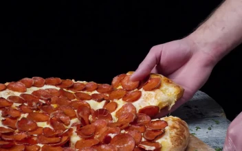 Free Video Stock taking a slice of fresh pizza