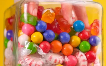 Free Video Stock taking candy from a pot that is on a yellow