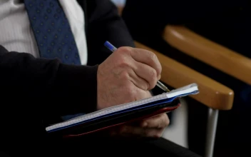 Free Video Stock taking notes with a pen during a seminar