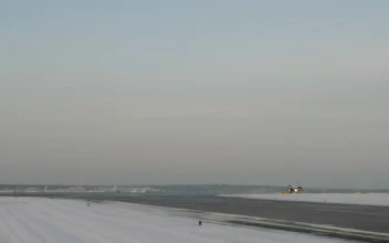 Free Video Stock taking off from a snowy airfield