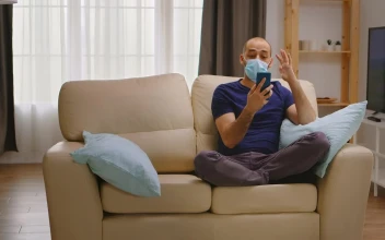 Free Video Stock talking on the phone while wearing a mask