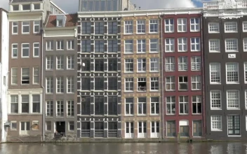 Free Video Stock tall houses along a river