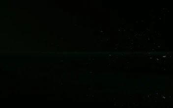 Free Video Stock tangerines bouncing on a black water surface