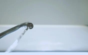 Free Video Stock tap turns on to pour water seen from below