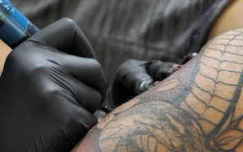 Free Video Stock tattoo artist filling in a tattoo