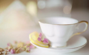 Free Video Stock tea poured into classic china tea cup with flowers
