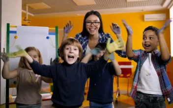 Free Video Stock teacher and students waving with painted hands