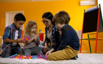 Free Video Stock teacher with little children playing with legos