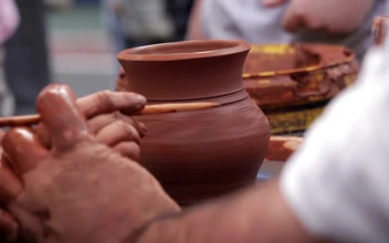 Free Video Stock teaching a child to craft clay pots